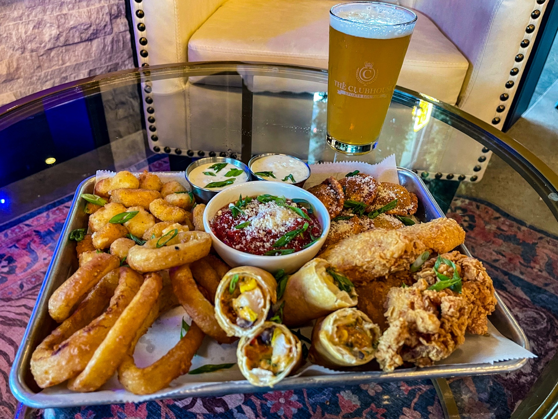 Clubhouse appetizer sampler with cheese curds, tenders and beer
