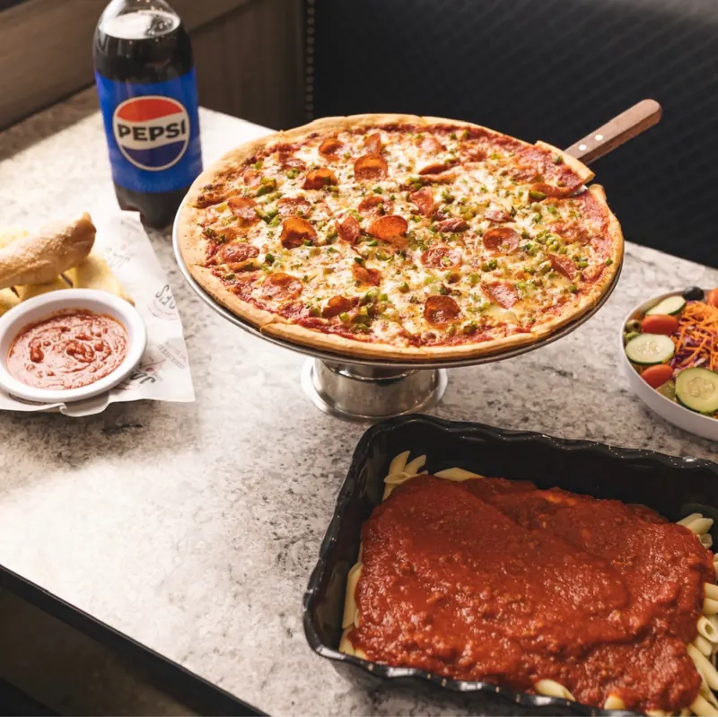 Pizza, pasta, salad and breadsticks